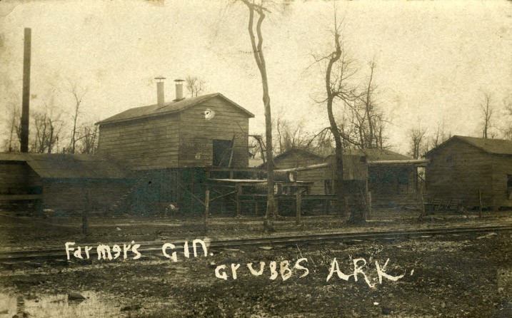 A black and white photo of an old gin