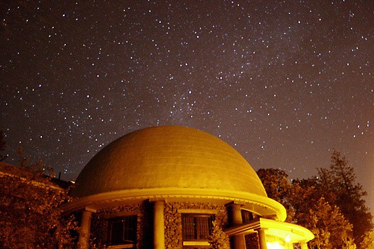 The Lowell Observatory rotunda under a night sky