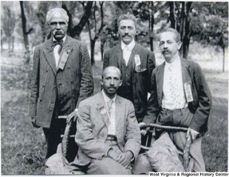 John R. Clifford, standing top left, L. M. Hershaw, standing center, F. H. M. Murray standing to the right, and W. E. B. DuBois seated in center. Photograph taken in 1906 at the Niagara Movement's Second Annual Meeting. Photo courtesy of West Virginia & R