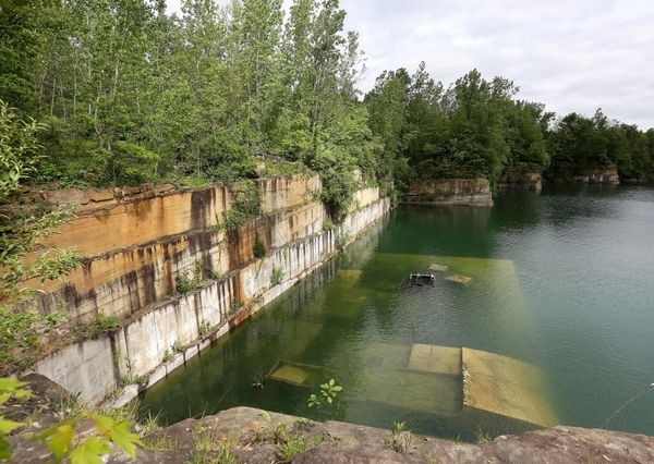 This picture helps show what the quarry has become now. The quarry was filled with water and only small sections are still able to be seen. 