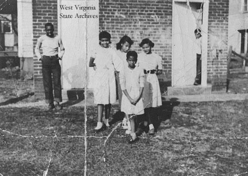 Children at Weston Colored School. Front: Mary Theresa Perkins. Back, left to right: Frank Jones, Rita Perkins Margaret Perkins, and Emmett Perkins.