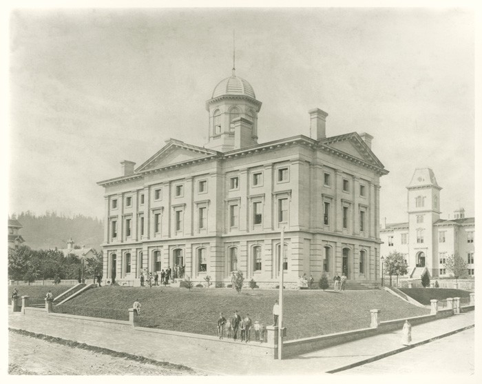 This historic image of Pioneer Courthouse shows the former public school, which also featured the Italianate style of architecture. 