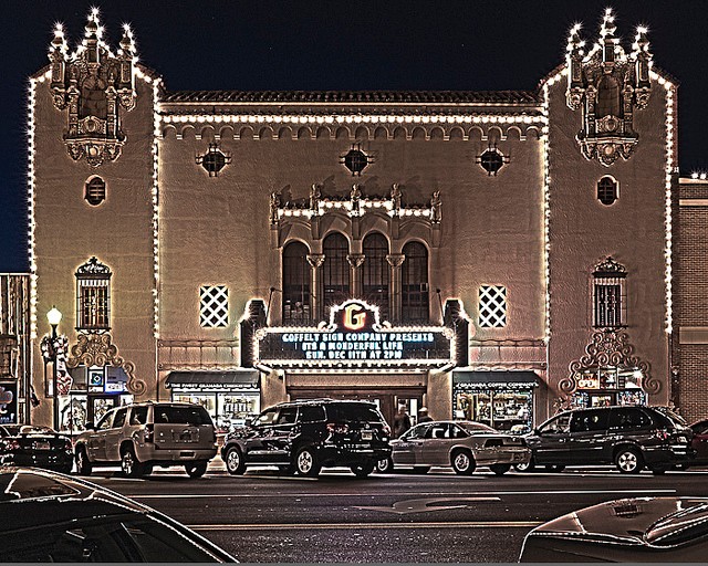 The Granada Theatre lights up at night, adding some beauty to the commercial area.