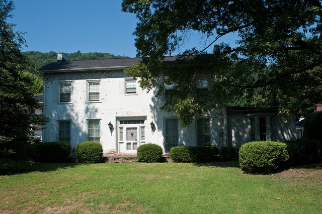 Main entrance of the Colonel Henry Hewitt Wood House - note that the entry faces the river, rather than the road