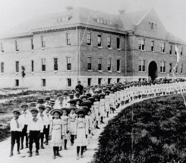 Children line up at the Mt. Pleasant Indian Industrial Boarding School.