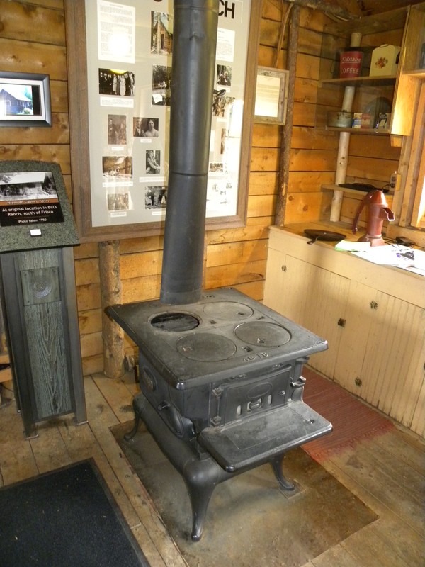 This cast iron wood burning stove used for cooking is one of two heat sources in the Niemoth Cabin; the fully functional fireplace was restored in the mid-80's once the cabin was moved to the Park.