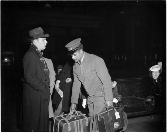 Union Depot Red Cap assisting travelers (1949)