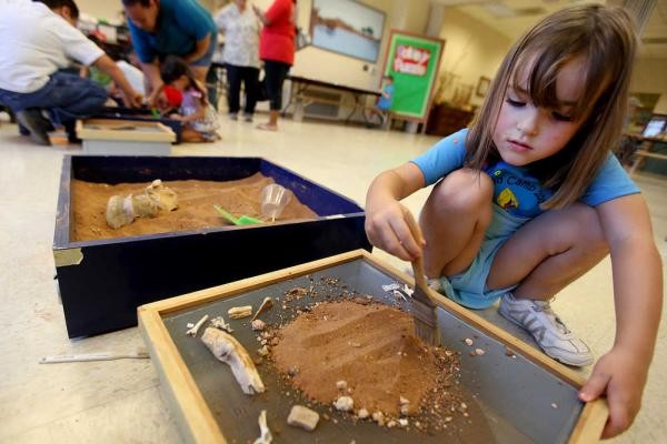 Digging and cleaning artifacts during an Archaeology in Action class at Lubbock Lake Landmark