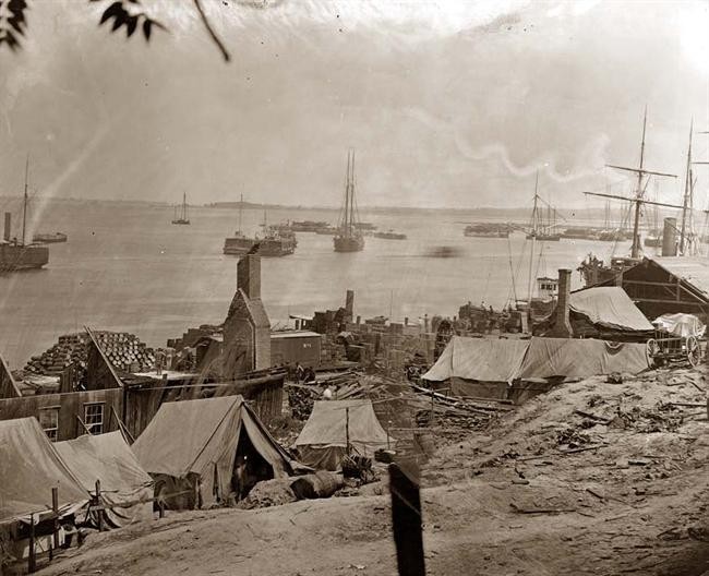 Union tents and supplies along the docks. Circa 1864-1865