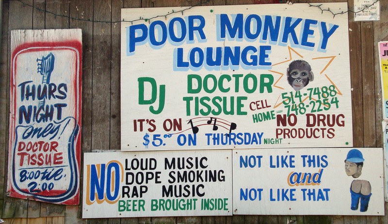 Signs on the exterior of Po Monkey's Lounge.