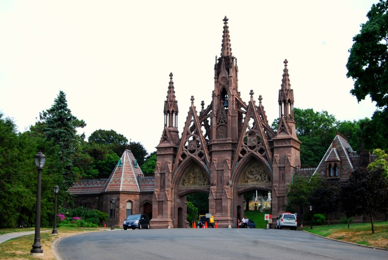 Visitors begin their journey by passing through the cemetery's Gothic main gate