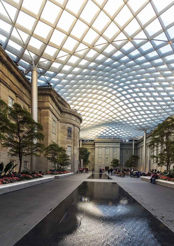 The Robert and Arlene Kogod Courtyard is a favorite spot for visitors both the National Portrait Gallery and Smithsonian American Art Museum. Photo by Acroterion, Wikimedia Commons.