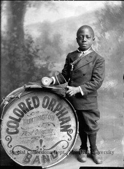 African-American youth with drum. Part of the ”Colored Orphan Band Huntington, West Virginia, C. E. Mghee Manager” in 1914. Courtesy of Marshall University's Special Collections.  