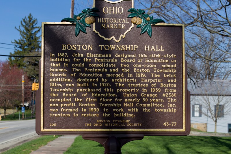 A historic plaque commemorating the Boston Township Hall and its designer.