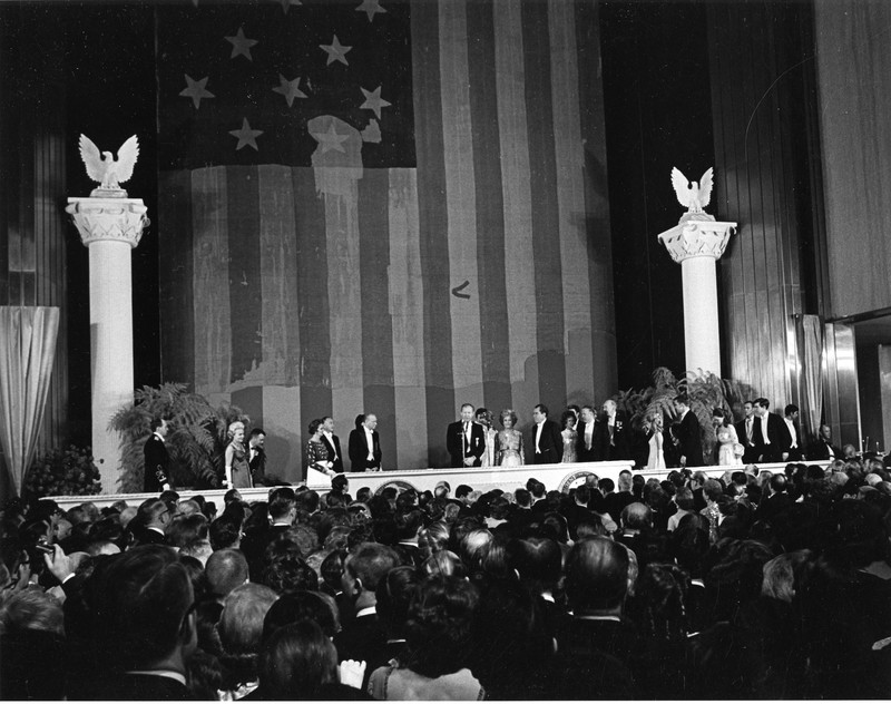 The Museum hosted President Richard Nixon's inaugural ball on January 20, 1969. Honored guests stand at the podium in front of the Star-Spangled Banner. Photo courtesy of the Smithsonian Institution Archives. 