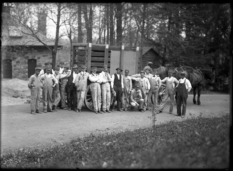 Zookeepers gather in front of a horse-drawn wagon carrying a bison inside a crate. Behind them is the animal hospital. Photo circa 1910s, courtesy of the Smithsonian Institution Archives. 