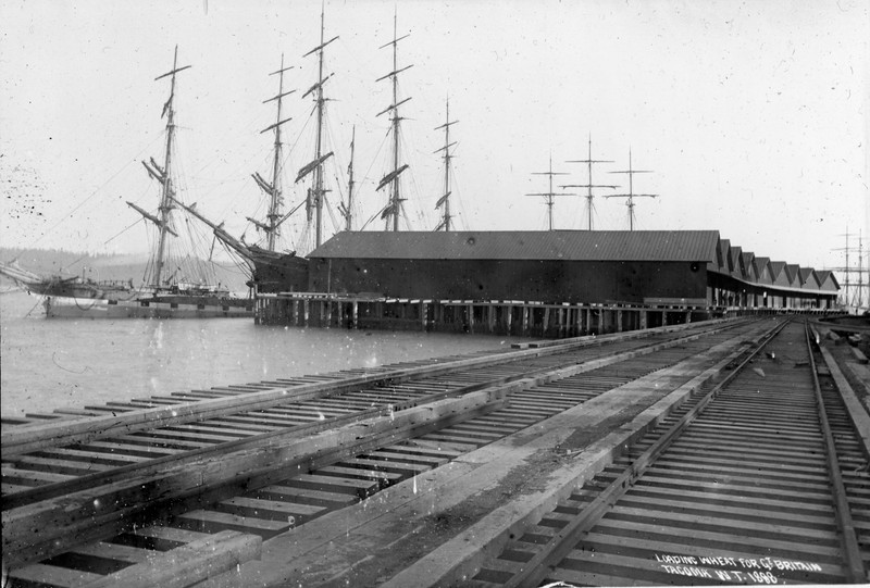 Northern Pacific Railroad tracks past grain warehouses and the ships that kept them full of product.