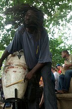 Member of the drum circle playing in the park