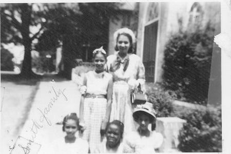 undated photo of family in front of St. Philips. Courtesy of JCBHPS