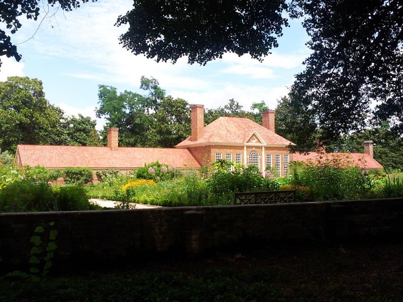 The greenhouse in Mount Vernon's Upper Garden, built in the 1780s and 1790s. One of the first greenhouses in North America, it provided a hot climate for tropical plants. Slave housing was located in the wings. Photo courtesy of Laura Maple