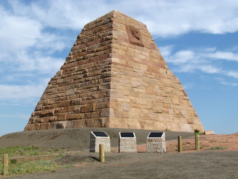 The massive Ames Monument with historical markers in the foreground. 