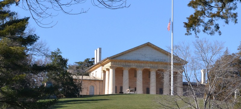 Arlington House is a neoclassical mansion, its most prominent feature being the large columns. It overlooks part of what is now Arlington National Cemetery. 