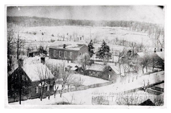 1860s wintertime shot of Old Salem. Log church on far right