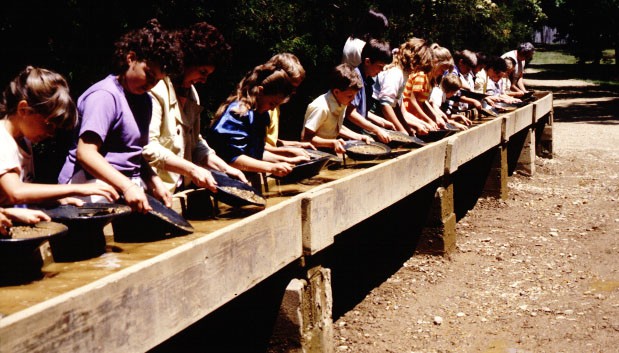 Tourists panning for gold