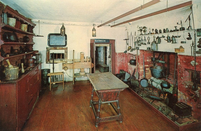 The cluttered kitchen used by the gaol's warden and family.