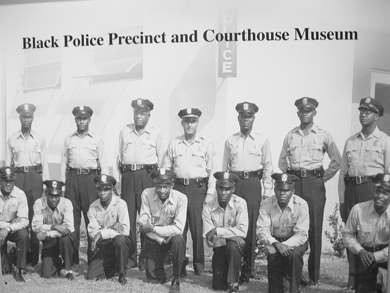 Photo of some of the first officers outside their new precinct house.