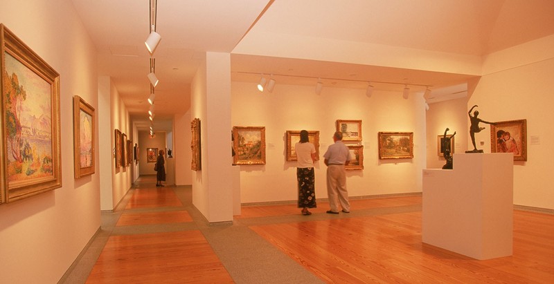 Paintings and Sculptures Within a Museum Gallery