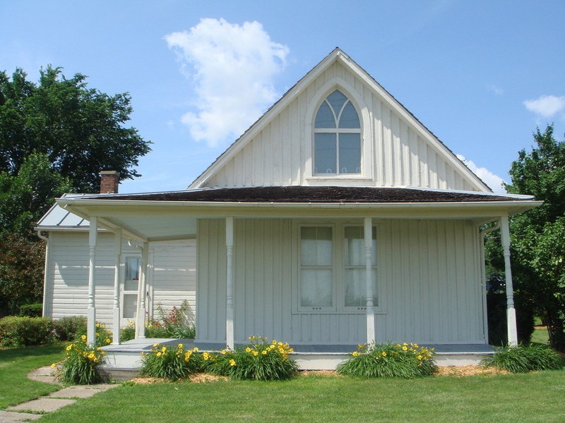 "American Gothic" by Grant Wood
http://www.americangothichouse.net/about/the-painting/