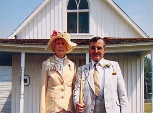 Couple posing for photograph
http://www.americangothichouse.net/chronological-history-of-the-american-gothic-house/