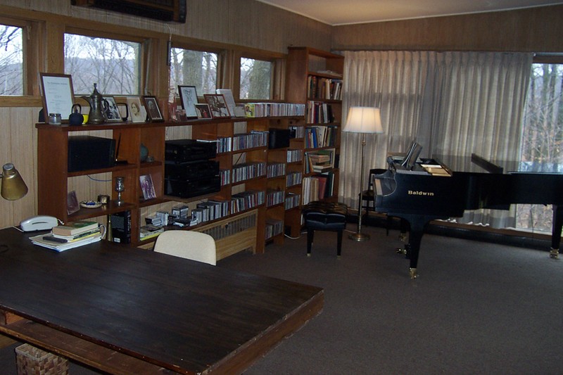 Recent image of Copland's studio, with piano, books, photographs, etc.