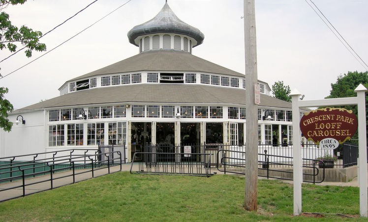 The Crescent Park Looff Carousel, housed inside Loof's famous "hippodrome" buildings which feature his trademark onion-shaped dome. Credit: John Caruso, 2007 (http://carousels.org/psp/CrescentPark/DSCN0106.html)