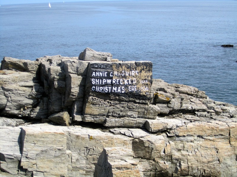  Memorial to the Annie C. Maguire shipwreck in 1886. Written by lighthouse keeper John A. Strout in 1912. Since then, subsequent keepers have maintained the memorial, and its original lettering is seen in this photo.