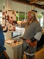 Viking Paul gives a group tour of the Viking exhibit