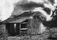Cabin burning During the Rosewood Massacre.