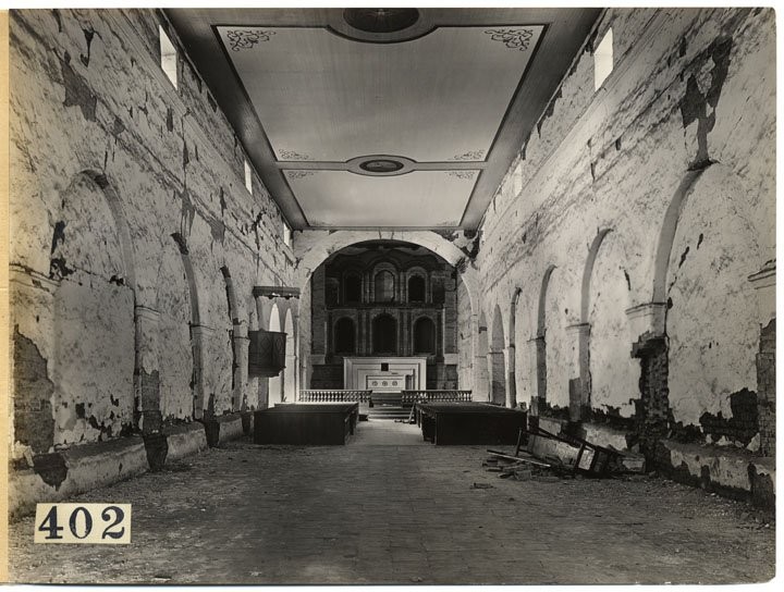 This photograph of the chapel interior from 1908 displays unrepaired damage from the 1906 San Francisco earthquake (CA State Library).