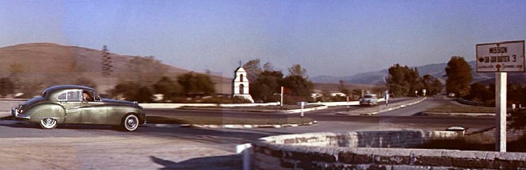 Scene from VERTIGO. Private Detective John "Scottie" Ferguson (Jimmy Stewart) enters the town of San Juan Bautista as he follows a client's oddly behaving wife, Madeleine, played by Kim Novak.