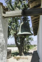 Original Mission Soledad Bell located outside by entrance in 2003. Since then it has been moved inside museum for safety and replaced with a smaller bell. 