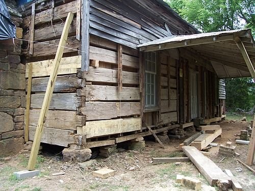 A picture showing the replacement of several logs