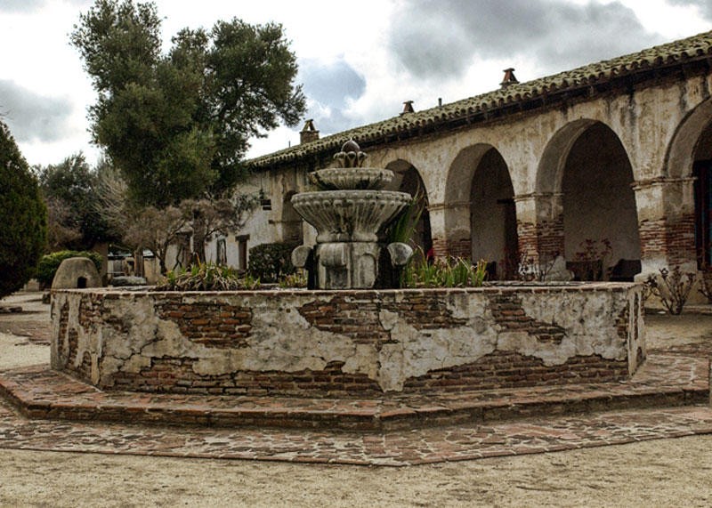 Mission San Miguel Arcangel fountain in mission garden. While not orginally part of the mission complex, it is considered to be well-matched to its architectural style, and is patterned on the fountain at Mission Santa Barbara.