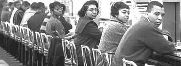 Another photo depicting African American men and women sitting at the lunch counter.