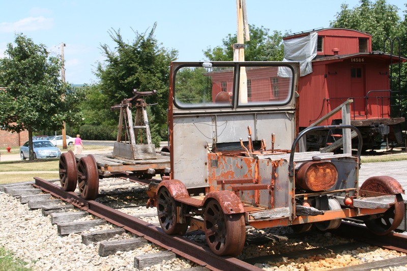 Pump handcar (left) and open-top speeder (right)