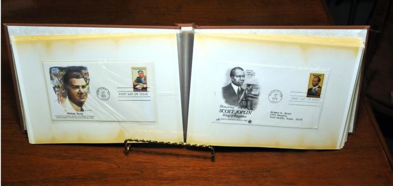 This is a scrapbook of the postage stamp collection.  It features famous African Americans such as: Booker T. Washington and Martin Luther King Jr.