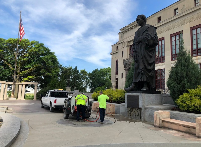 “RAPIST” spray-painted onto the base of the statue on June 17, 2020.