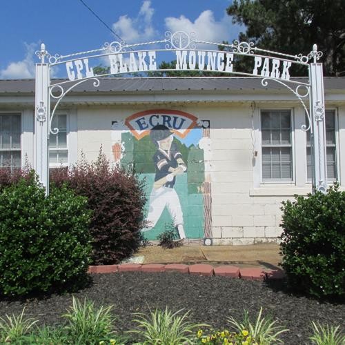 Park building with mural of baseball player