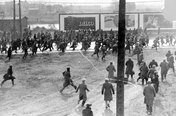 Ford workers flee after being fired upon with tear gas by the Police and Ford's security guards