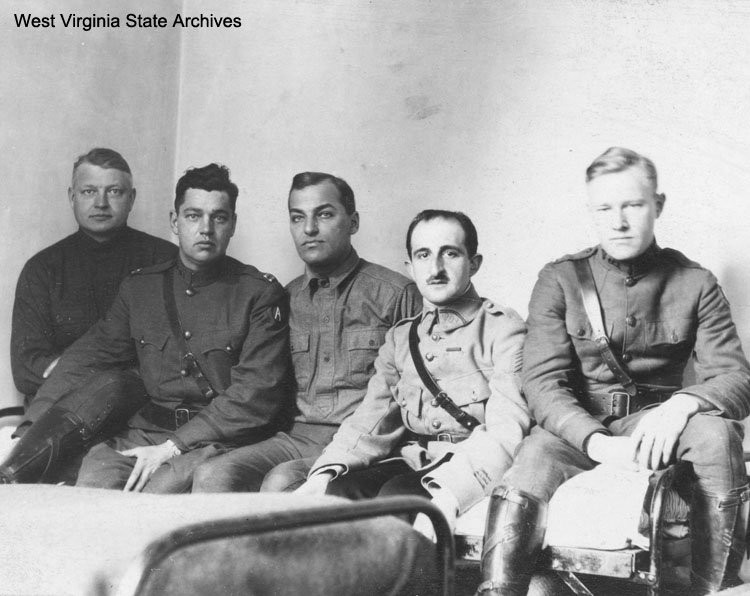 Officers relaxing in barracks in France, circa 1919. From left to right: Capt. Karl C. Pritchard of Huntington, Capt. Cox, Lt. Geistly, Capt. Lalubie, an unnamed French Officer and Lt. Denton. Karl C. Pritchard Collection, West Virginia State Archive